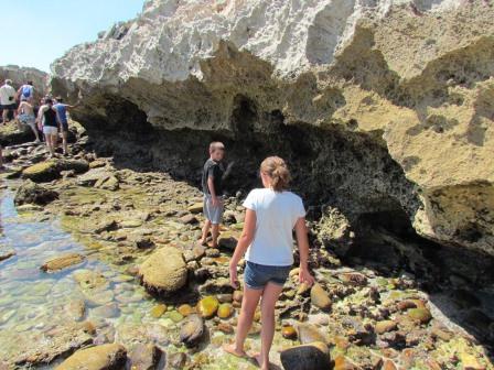 Making our way gingerly across the slippery wet rocks