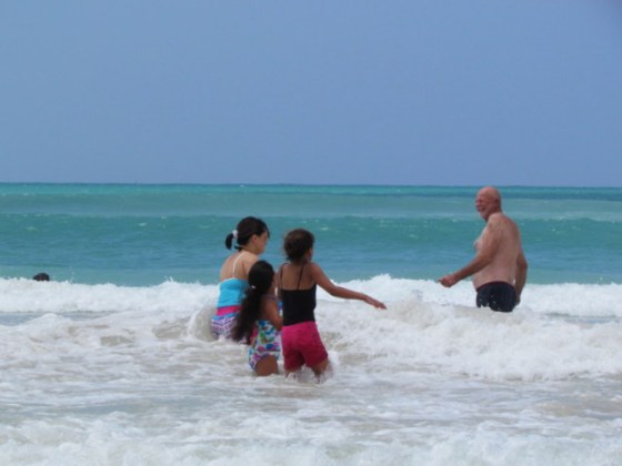 Grandpa Earl encouraging the girls to come in deeper