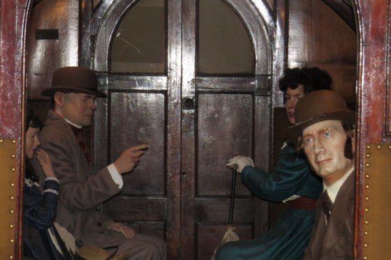 People in a grand railway coach