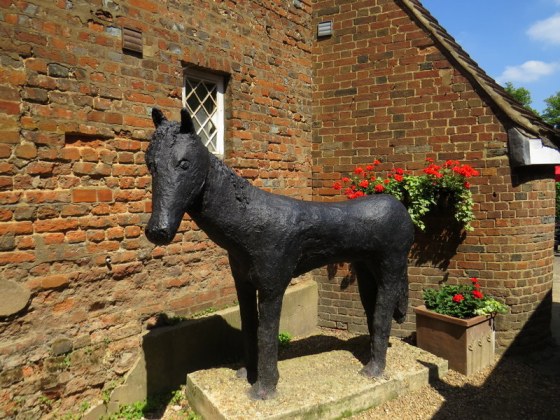 A rather out of proportion statue of The Black Horse I think,
