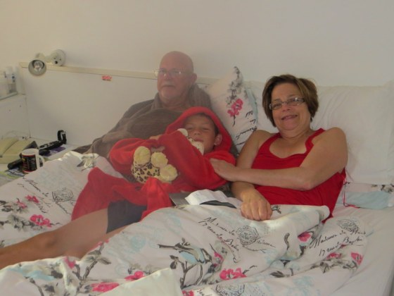 Our precious grandson tucks in with Granny and Grandpa